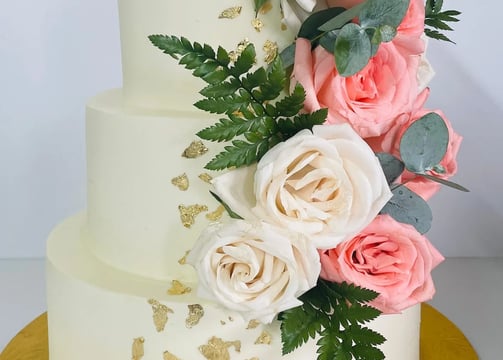 a cake with flowers on top of a yellow plate