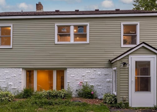 Completed siding and windows by Golden Hammer Construction in Twin Cities