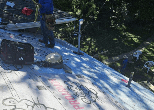 Roofing crew from Golden Hammer Construction installing architectural shingles