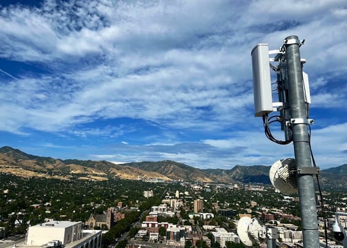 a cell phone phone tower with a antenna on top of it