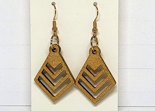 a pair of gold earrings with gold findings