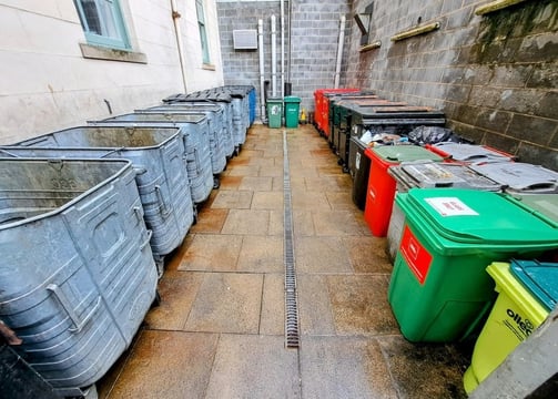 various commercial sized bins and wheeled bins contained with a bin store 