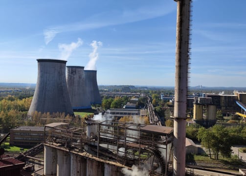 a factory with smoke stacks and smoke stacks