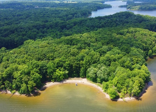 a large body of water with a small island in the middle