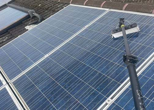 exterior cleaning services Fife - a extendable brush cleaning solar panels