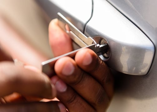 a person holding a cell phone in their hand