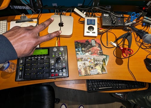 hazema by his studio desk with a keyboard and mouse