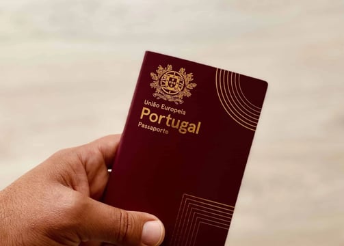 a person holding a passport and a passport
