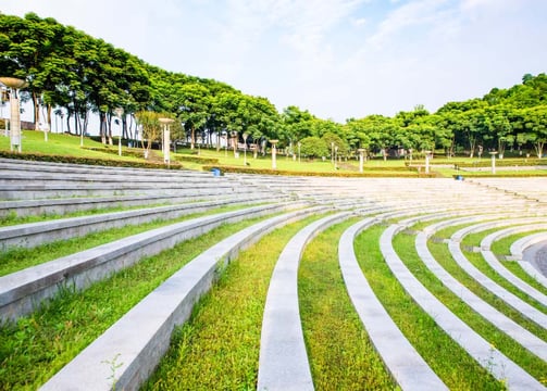 Peaceful temple surroundings designed with traditional elements and foliage by Garden Designers