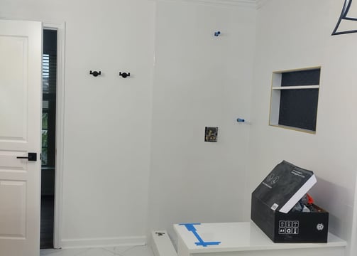 a room with a printer and a printer on the floor