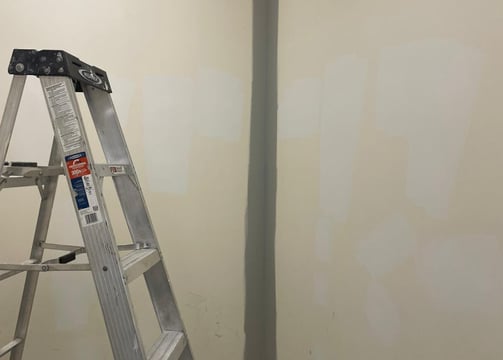 a ladder ladder ladder in a room with a ladder