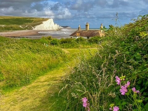 image of the famous Fishermans cottages with the cliffs of the Seven Sisters. 