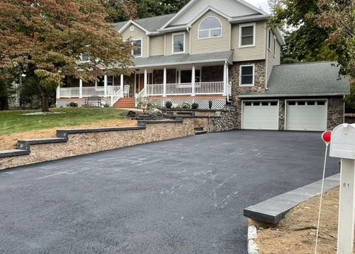 a driveway with a driveway and driveway with a driveway sign