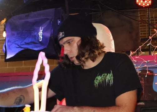 a man sitting at a dj table