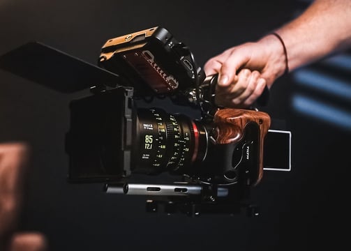 a person holding a camera and taking a picture