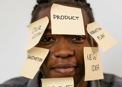 a man with sticky notes on his face
