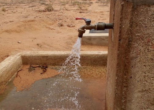 Sustainable water well in an African village providing clean drinking water to rural communities