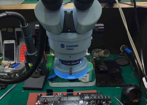 a microscope microscope and some tools on a table