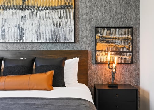 Elegant gray wallpaper accent wall in a modern bedroom, adding texture and sophistication to the space