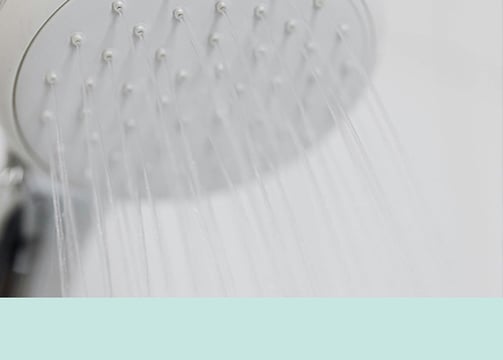 Water flowing from a shower head.