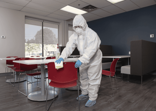 Crew is disinfecting all the high touch areas where employees meet in the conference room.