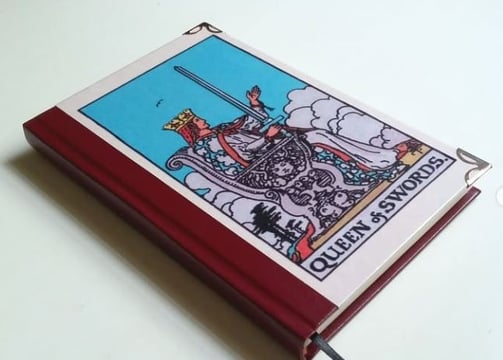 a book with a picture of a tarot of tarot