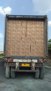 a truck with a large wicker on the back of it