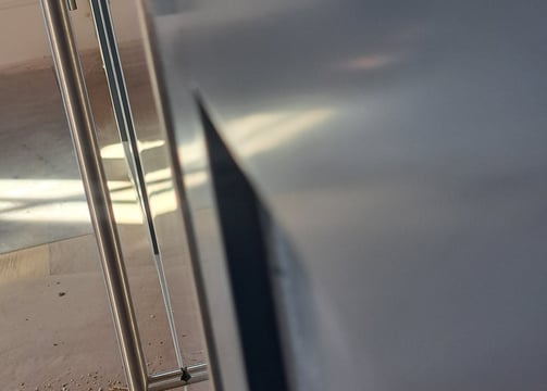 shows the precise alignment of an ice machine front door panel and a cabinet door panel