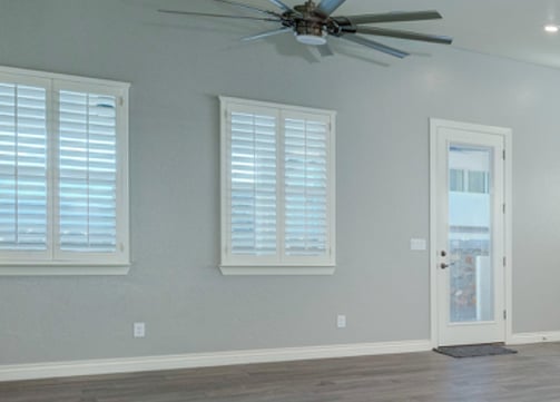 white shutters blue kitchen open space