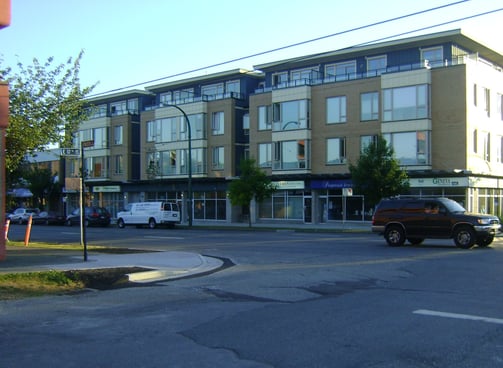 a building with a lot of cars parked in front of it