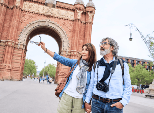 A couple tourists traveling together pointing at landmark