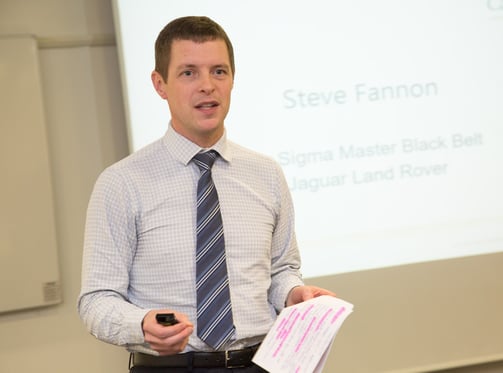 Steve Fannon presenting to a dinner audience in a previous role and organisation.
