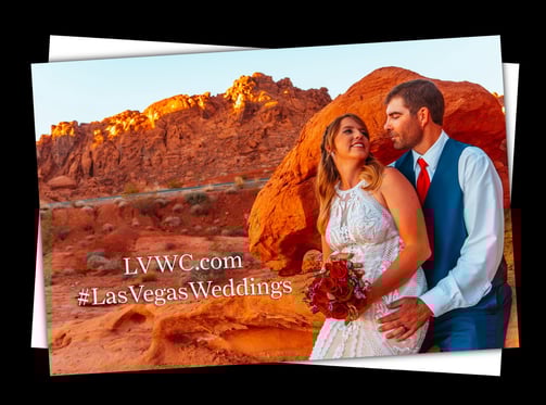 a couple standing in front of a mountain