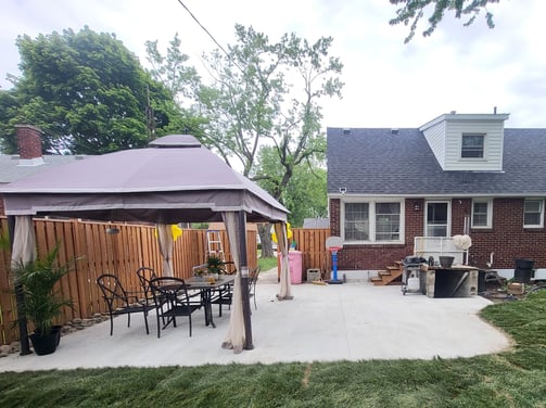 updated backyard with new concrete patio and fresh sod