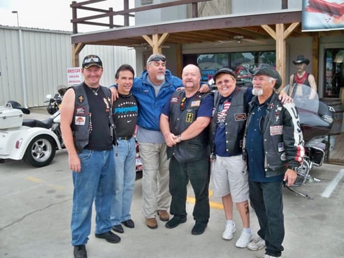 The crew at a motorcycle rally, sharing the Gospel and drawing biker caricatures.