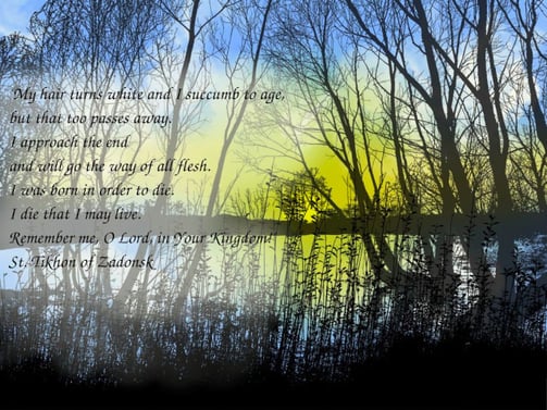 a picture of a lake at sunset with trees and a quote about aging from St. Tikon of Zadonsk