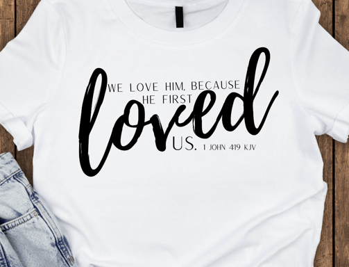 a t - shirt with a white shirt and jeans with 1 John 4:19 KJV on it the front of the t-shirt