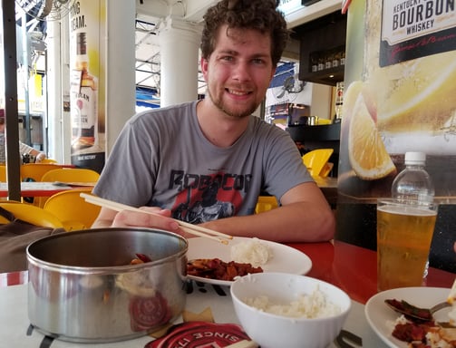 Steven enjoys some local cuisine in Chinatown of Singapore