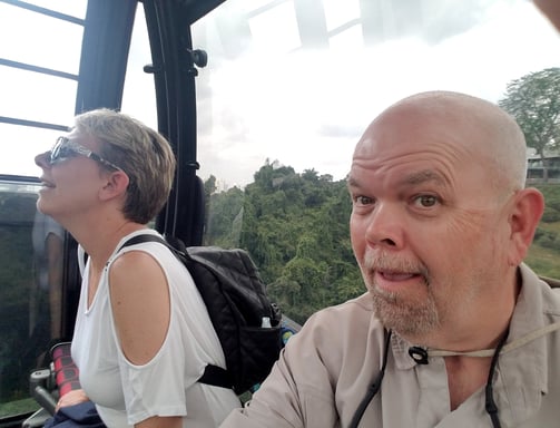 Lady and The Pirate ride the cable car to Sentosa Island in Singapore