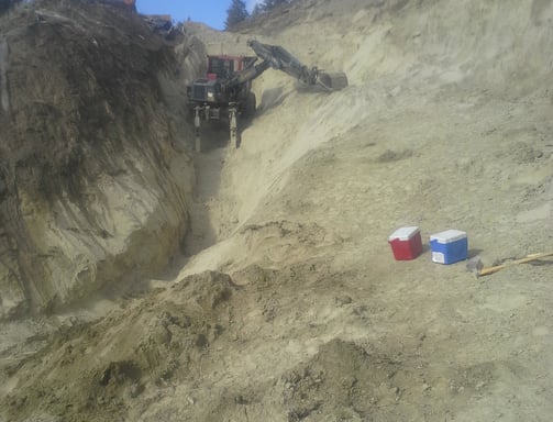 Spider conduction deep excavation of illegal garbage disposal site in sensitive conditions.