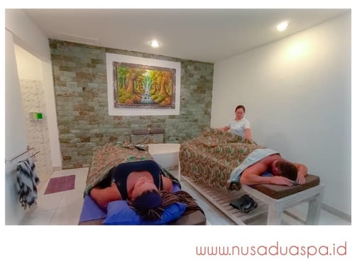 a woman is lying on a couch in a room