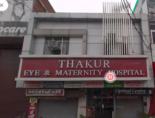 An image showing the facade of Thakur Eye and Maternity Hospital