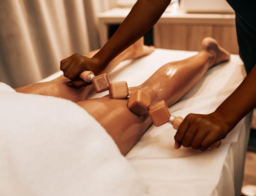 African American Women Doing Wood Therapy on Hamstrings