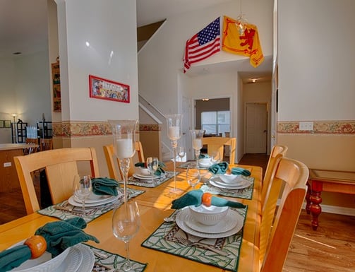 a dining room table with flags in florida