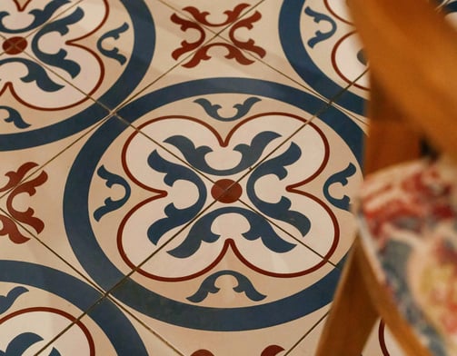 this image has hand painted tile in patio