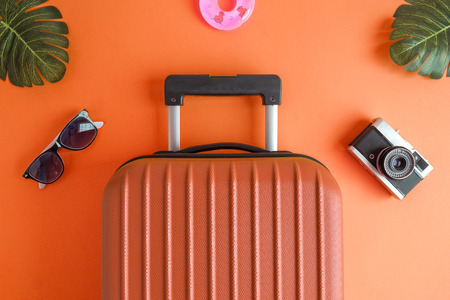 a suitcase with sunglasses and sunglasses on a table