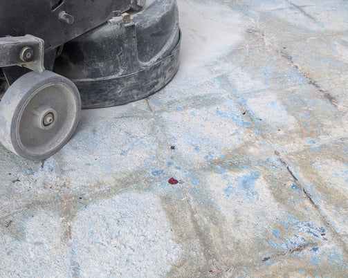 Lavina Concrete Grinder grinding and removing thinset