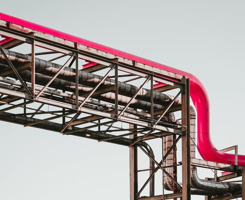 a red pipe pipe on a metal structure