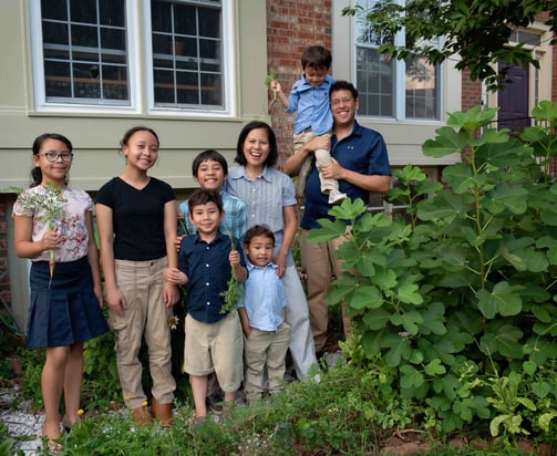 The Schauder family poses in their front yard garden.