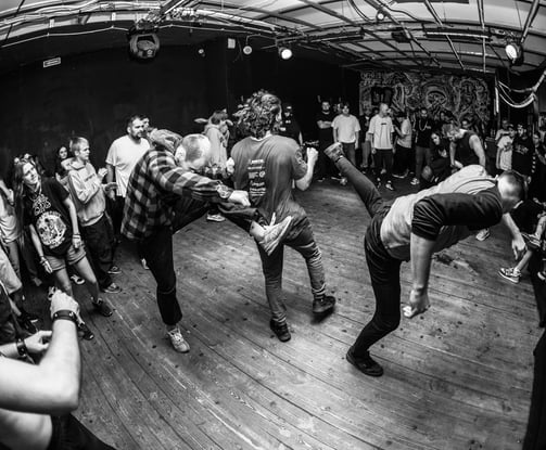 black and white photo fans at hardcore show